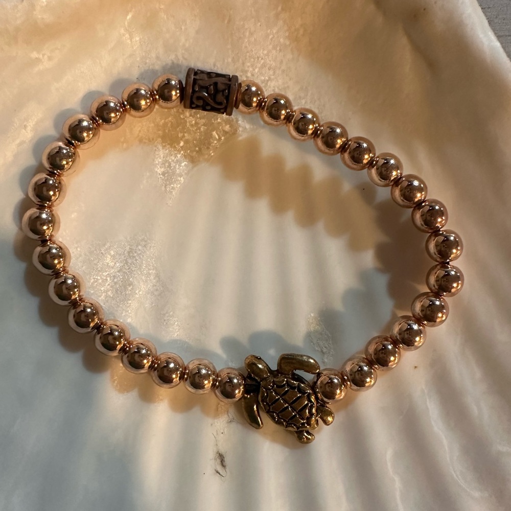 Gold beaded bracelet.